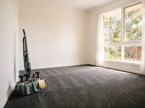 Empty carpeted room cleaned and ready for the final rental inspection